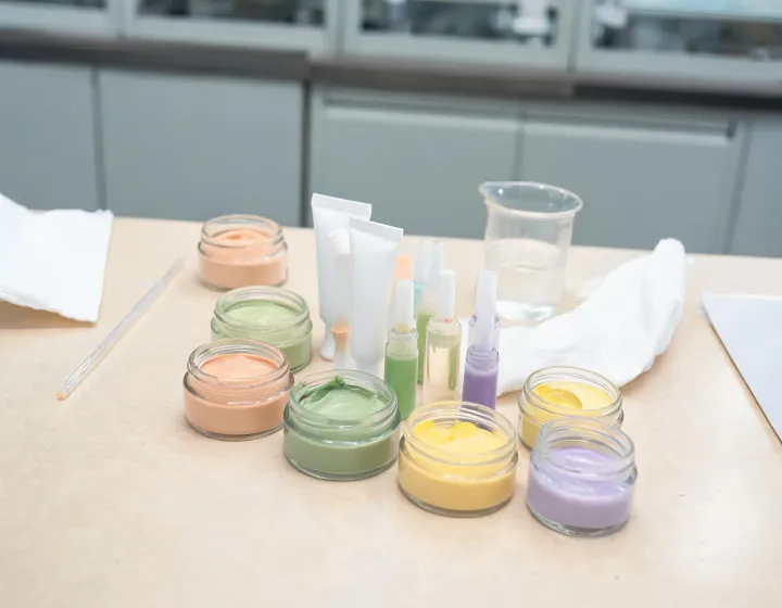 Color Corrector Sourcing on a cosmetics bench, illustration only